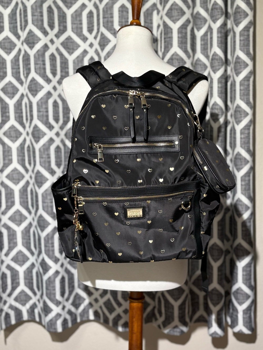 Madden NYC backpack black w/ printed gold heart emblems & detachable pouch